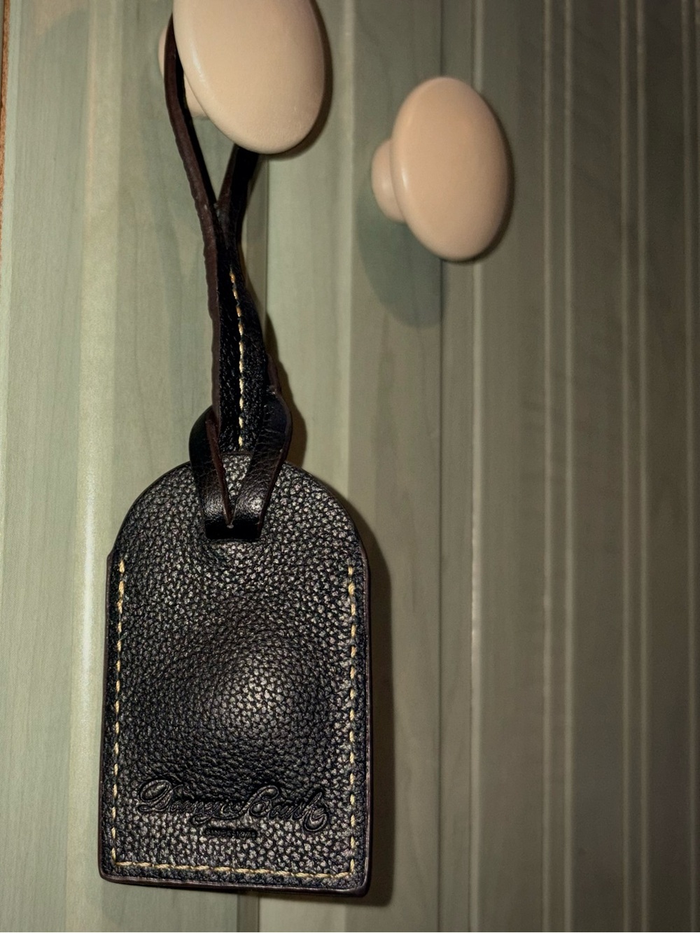 Dooney & Bourke black leather luggage tag